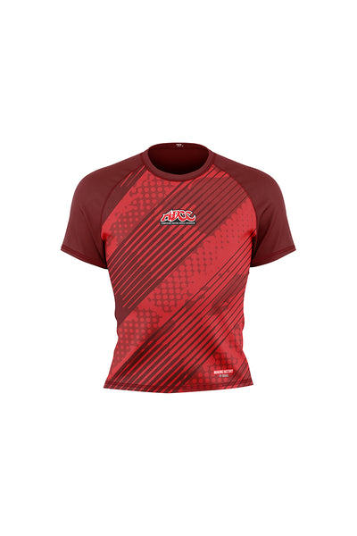 A red short-sleeved kids rash guard with a geometric pattern design.